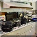 K01. Kitchen items, including pots, pans and utensils. 
